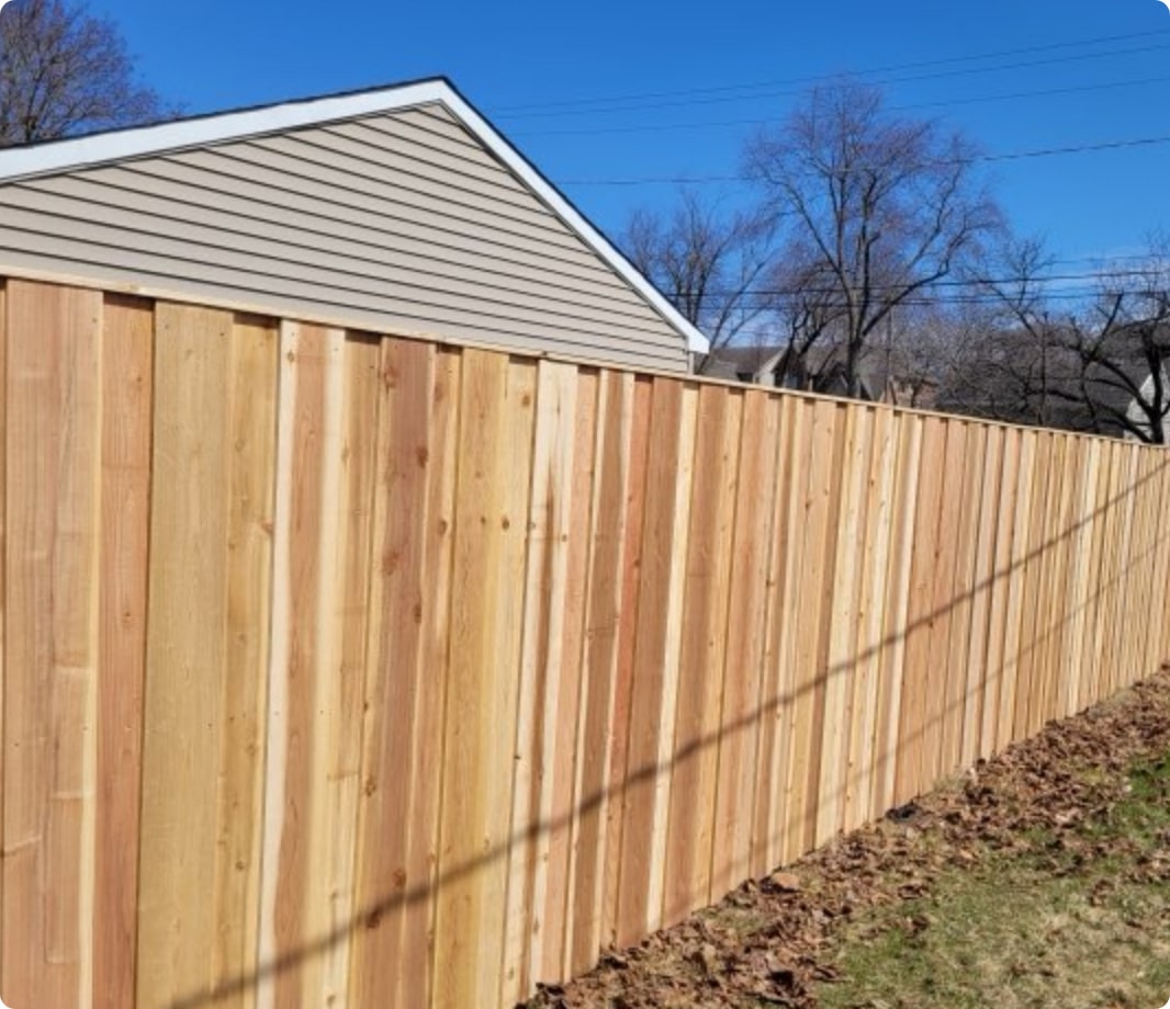 Board-on-board batten fence with cap