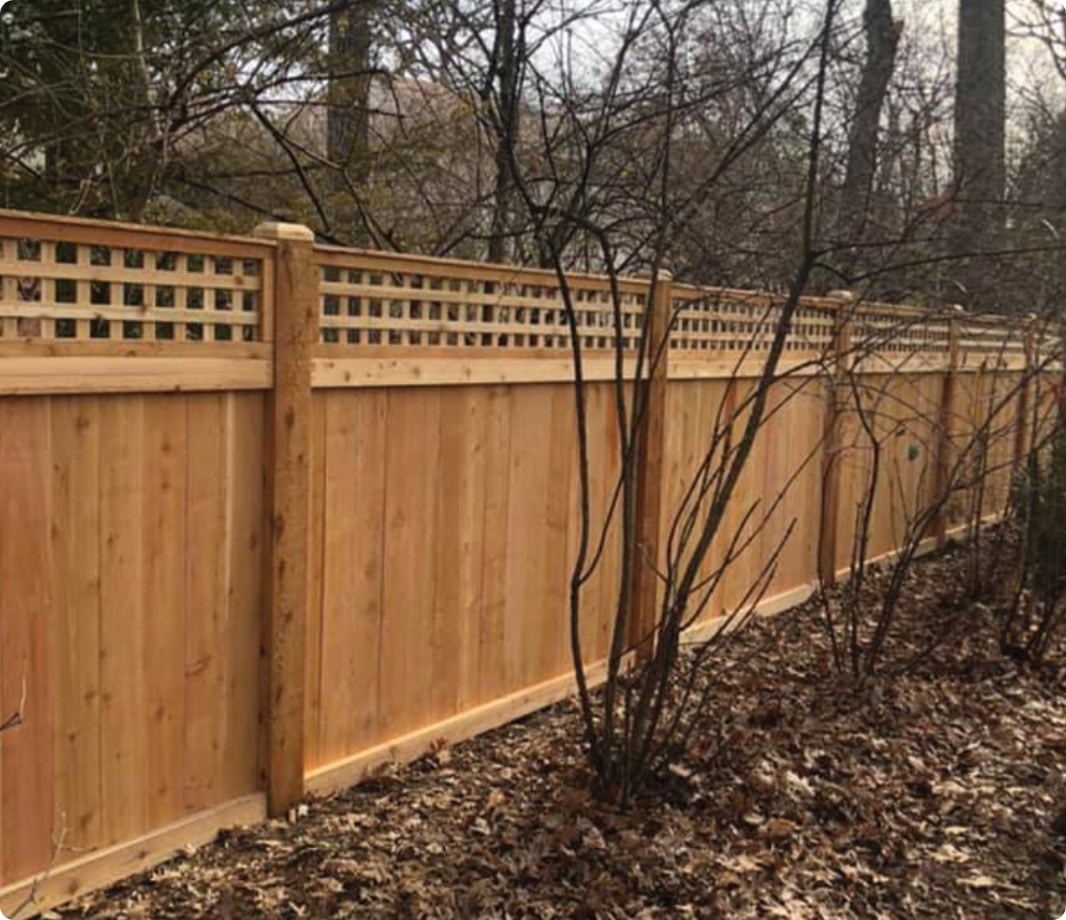 Solid wood fence with lattice topper