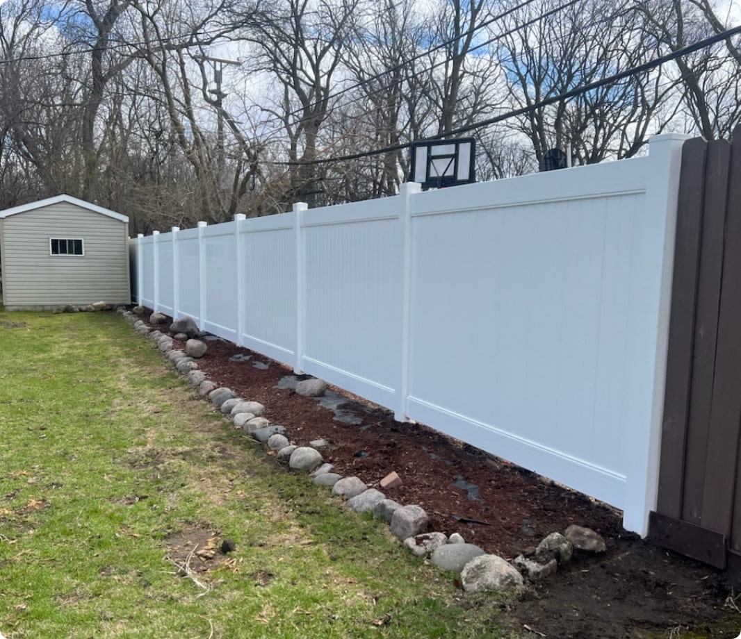 White solid vinyl fence