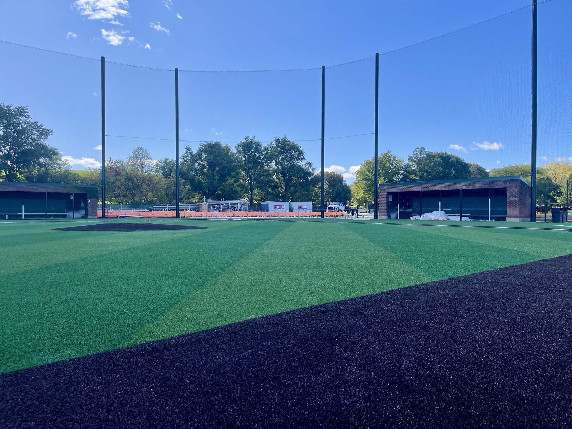 Ballfield netting installed for the backstop of a turfed baseball field